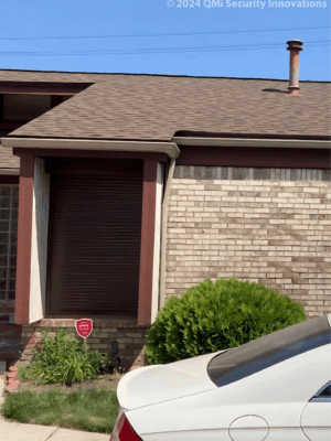 Security shutter style roll-up door installed on a home