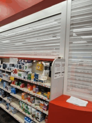 Security shutter style roll-up door installed at a store