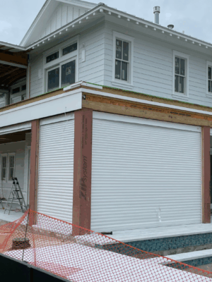 Security shutter style roll-up door installed on a home