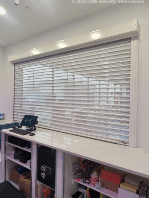 Security shutter style roll-up door installed at a laundromat