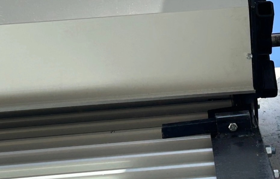 rolling-steel door and hood, close-up photo, minimal detail